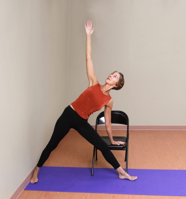 Utthita Trikonasana C hand on chair seat 9948 – Right to Joy